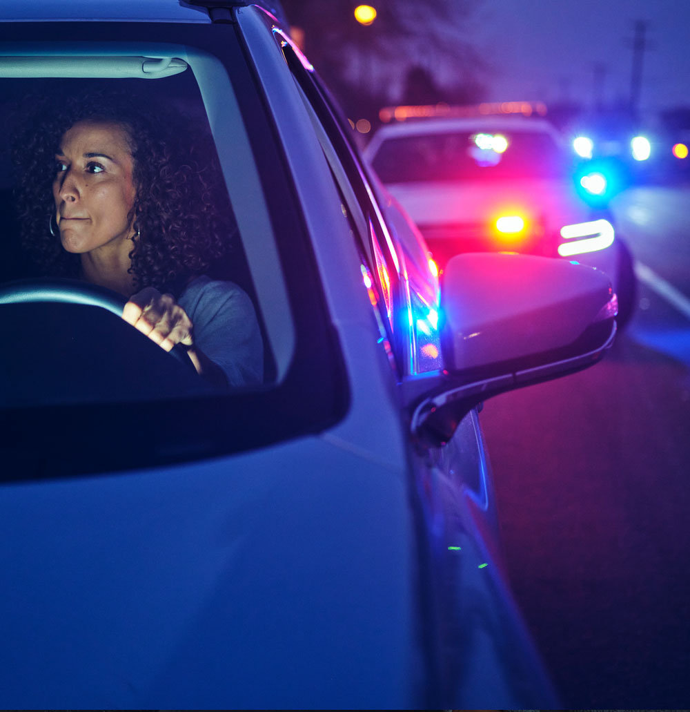 Woman getting pulled over for drinking and driving