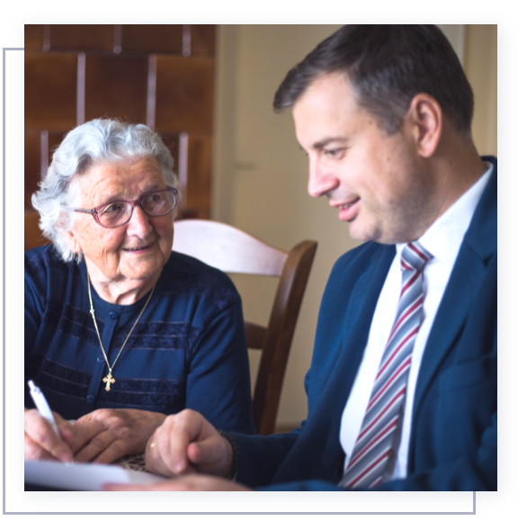 A lawyer helping an elderly woman with her estate