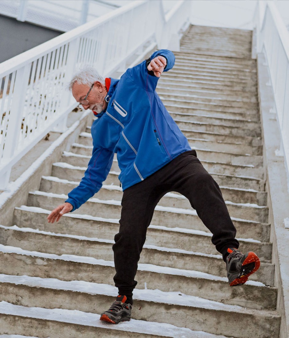 Elderly man falling down steps