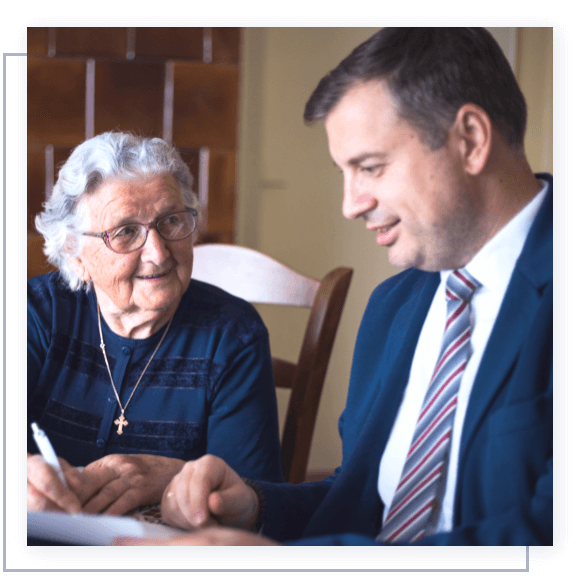 A lawyer helping an elderly woman with her estate