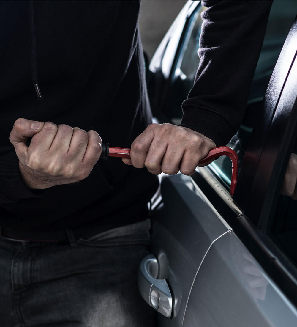 Man attempting to break into a car