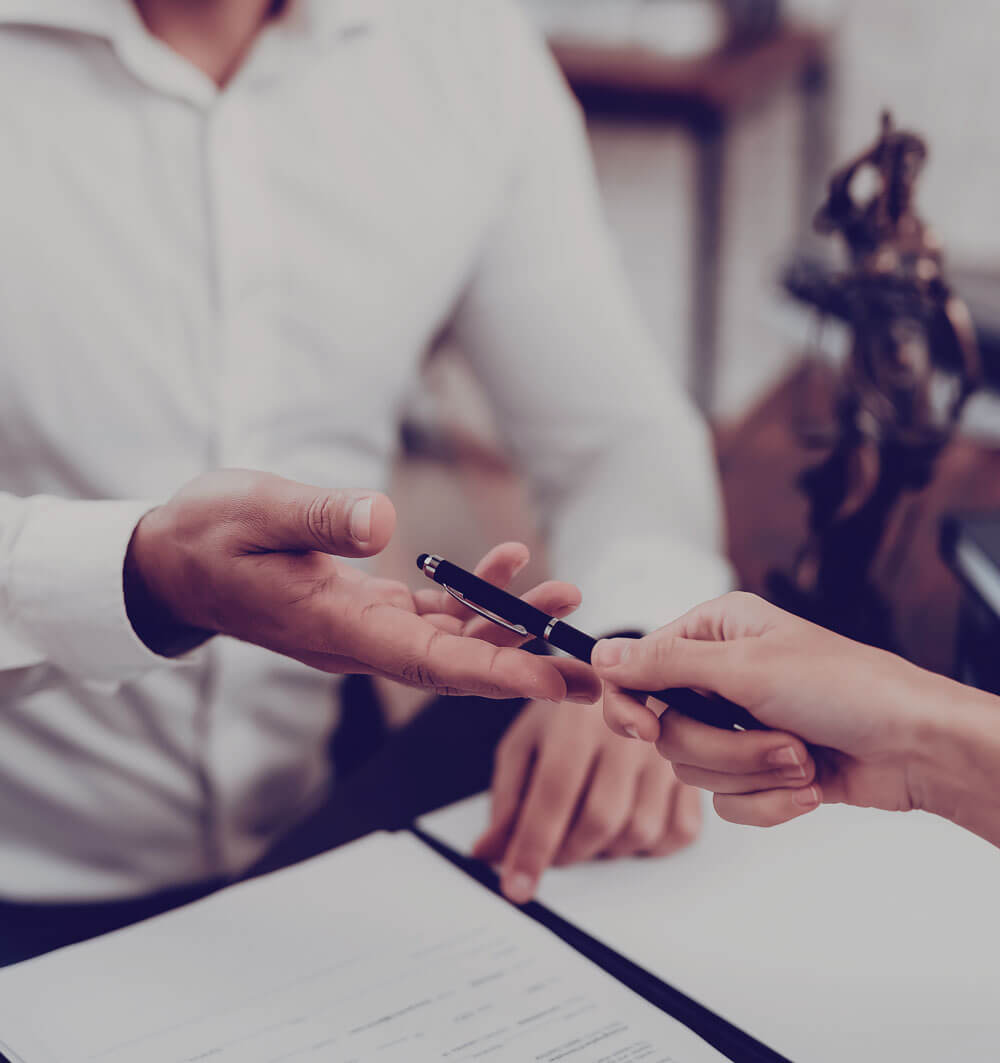 Man offering a pen to sign a contract